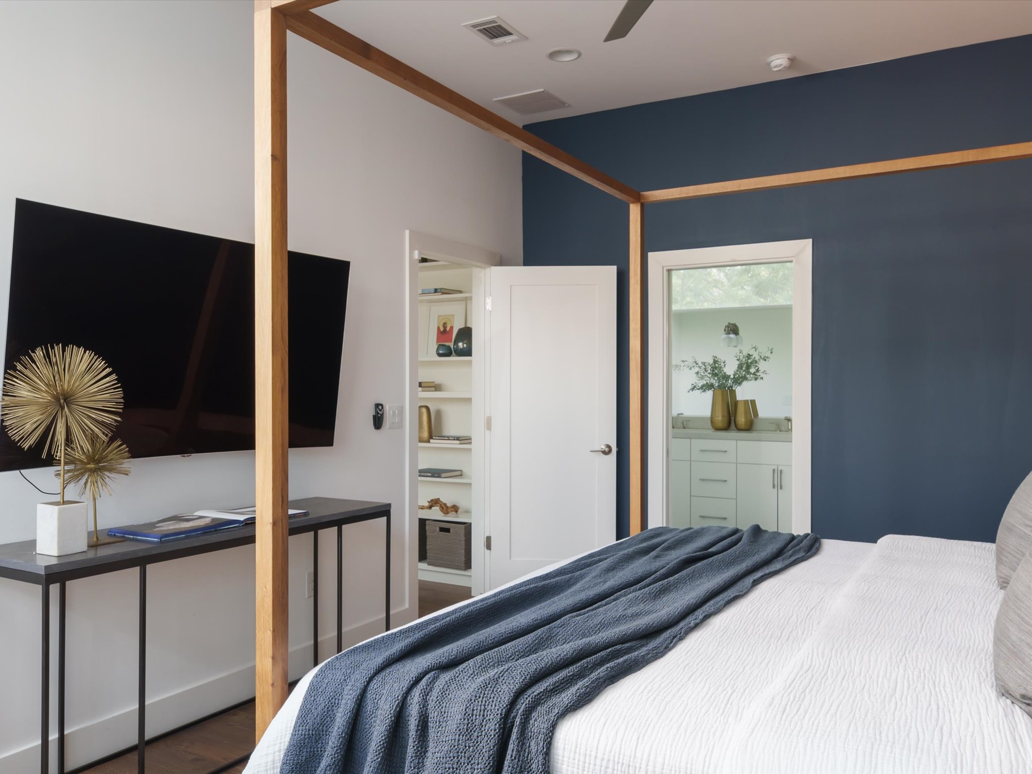 615 Jewell Street Austin, TX 78704 - Photo 13 of 25 Featuring tall ceilings, a designer accent wall, oversized windows with privacy features, and a luxury ensuite bath.
