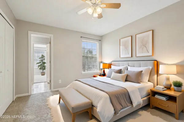 a bedroom with bed and a window