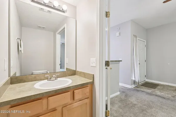 a bathroom with a sink and a mirror