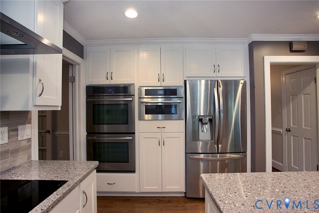 231 Hazelmere Drive Chesterfield, VA 23236 - Photo 9 of 33 a kitchen with kitchen island a counter top space cabinets and stainless steel appliances