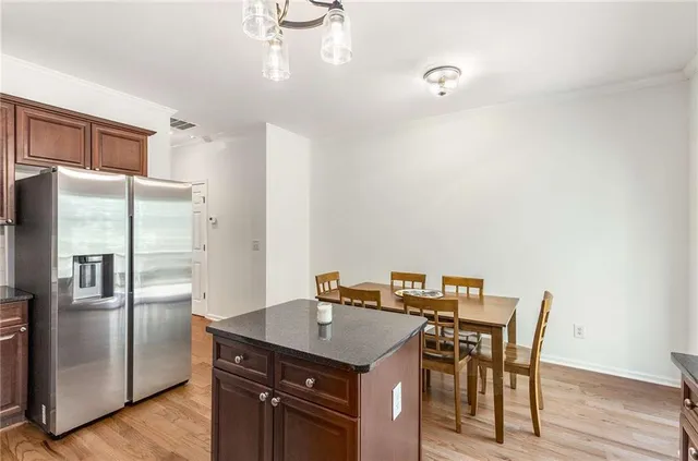 a kitchen with stainless steel appliances granite countertop a sink stove and microwave