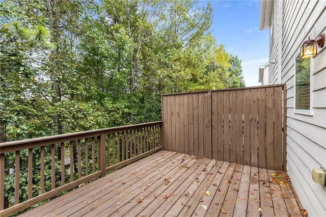 an aerial view of a house with a yard and sitting area