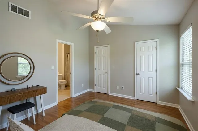 a view of a livingroom with a chandelier fan