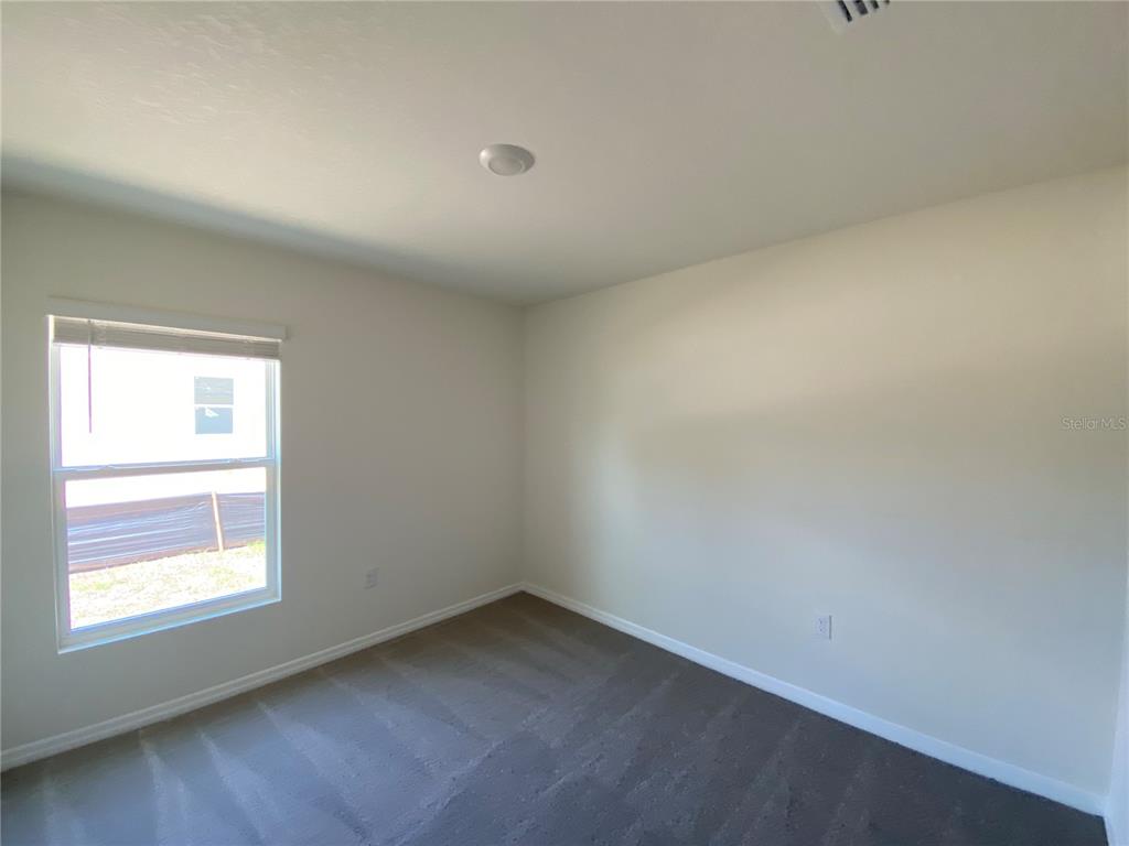 492 Hickory Course Loop Ocala, FL 34472 - Photo 15 of 28 an empty room with a window