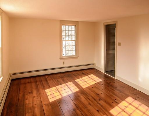 53 Burbank Road Sutton, MA 01590 - Photo 14 of 29 an empty room with wooden floor and windows