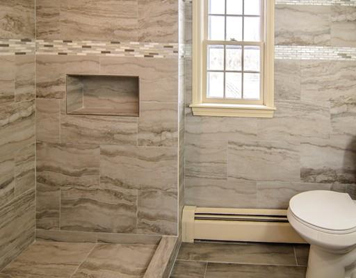 53 Burbank Road Sutton, MA 01590 - Photo 15 of 29 a bathroom with a toilet and a shower