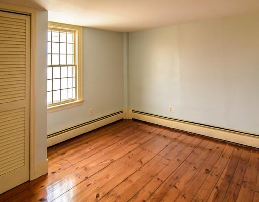53 Burbank Road Sutton, MA 01590 - Photo 17 of 29 wooden floor in an empty room with a window