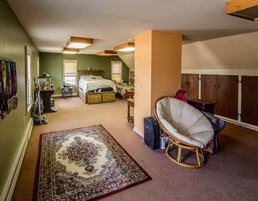 53 Burbank Road Sutton, MA 01590 - Photo 19 of 29 a room with gym equipment and a mirror