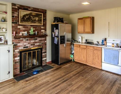 53 Burbank Road Sutton, MA 01590 - Photo 20 of 29 a kitchen with stainless steel appliances granite countertop a refrigerator stove and sink