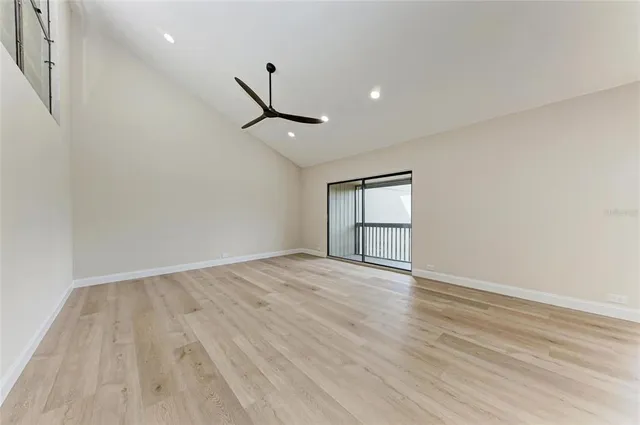 a view of a dining room with furniture wooden floor and chandelier