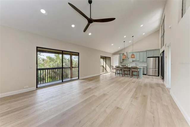 a kitchen with a sink cabinets and wooden floor