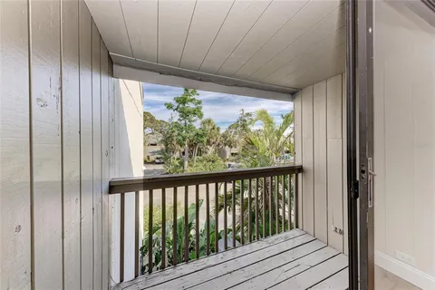 an outdoor space with swimming pool and furniture