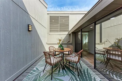 a bedroom with furniture and a flat screen tv