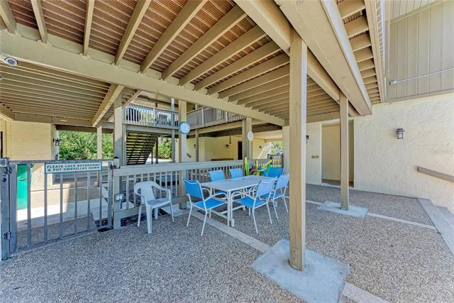 a view of chairs and tables in the patio
