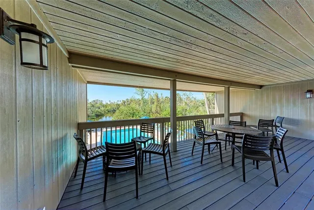 a view of a balcony with wooden floor