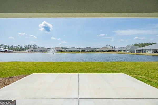 a view of a swimming pool and an outdoor seating