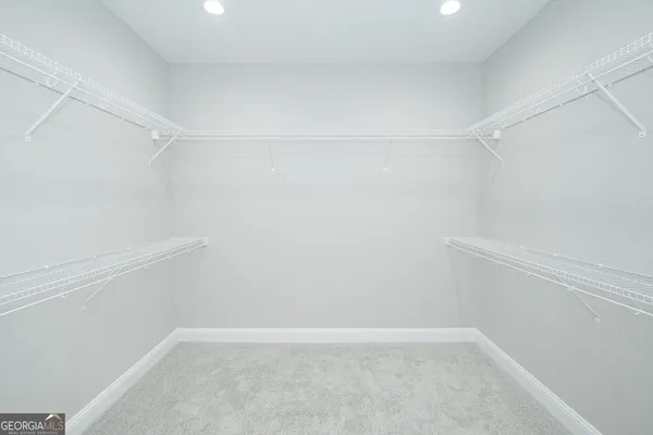 a view of an empty walk in closet