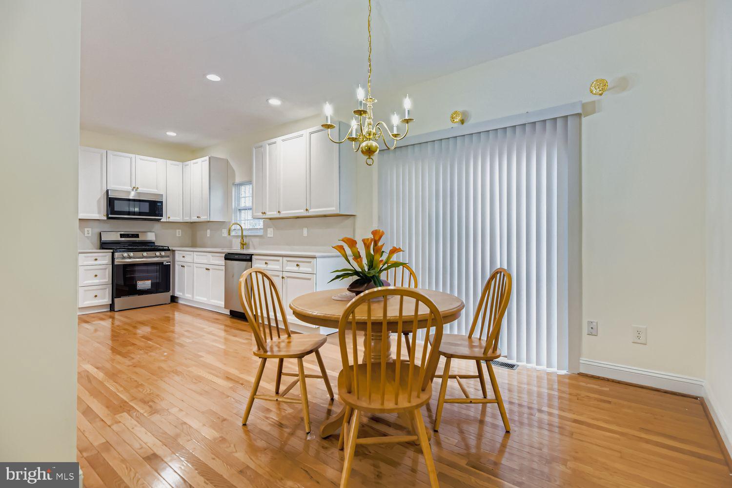 2218 Retreat Court Edgewood, MD 21040 - Photo 5 of 29 a view of a dining room with furniture and a chandelier