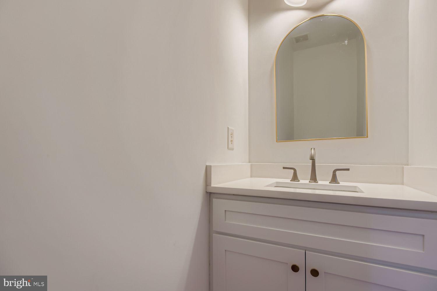 2218 Retreat Court Edgewood, MD 21040 - Photo 10 of 29 a bathroom with a sink and a mirror