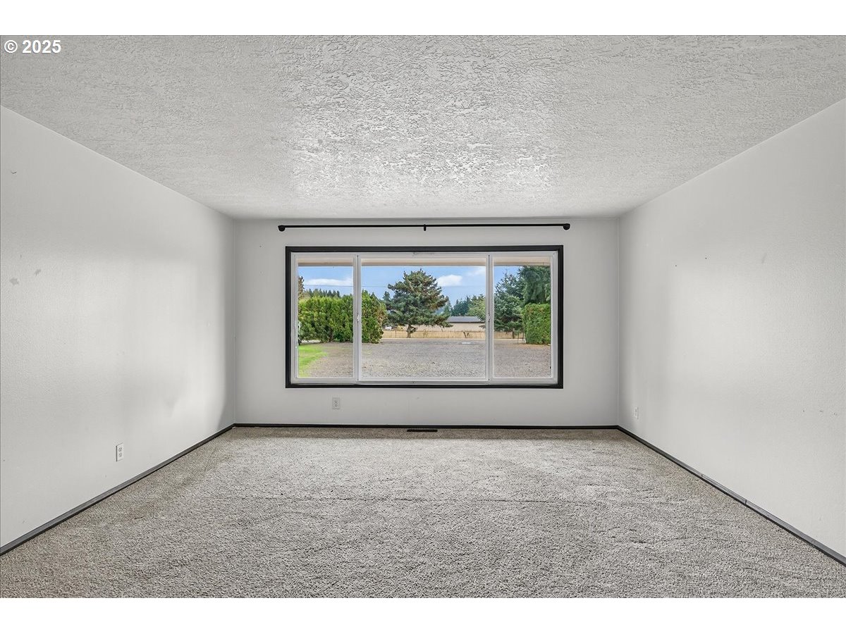 57827 South Bachelor Flat Road Warren, OR 97053 - Photo 17 of 38 a view of an empty room with a window