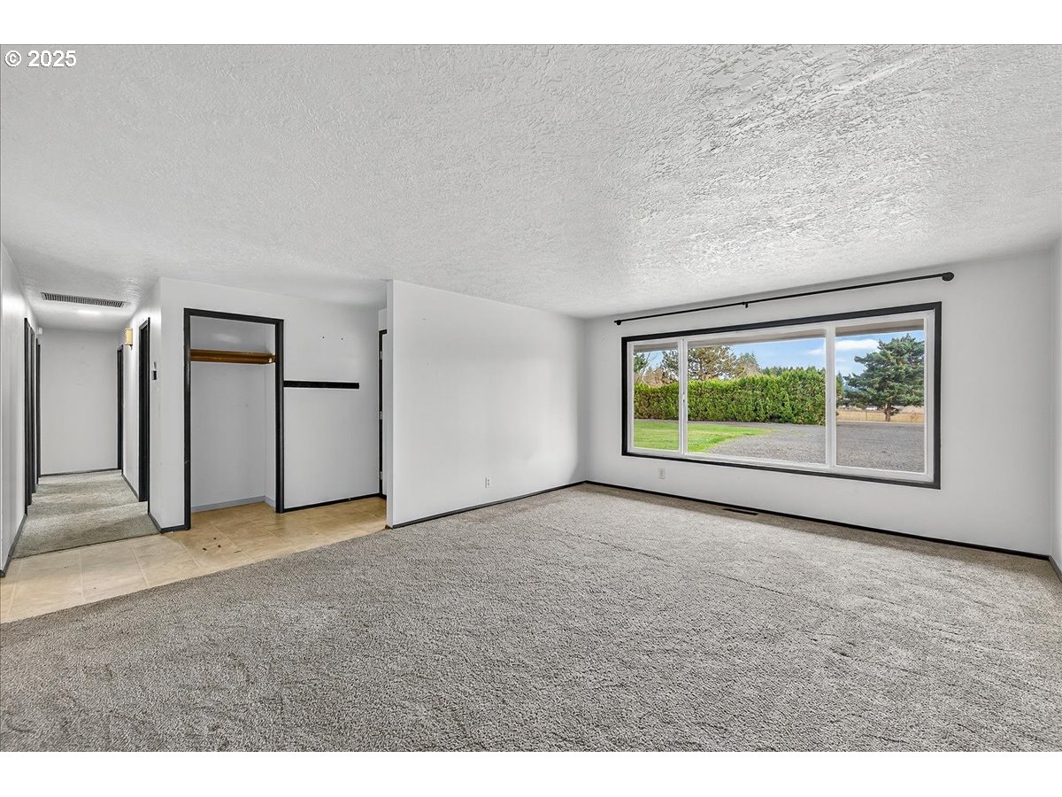 57827 South Bachelor Flat Road Warren, OR 97053 - Photo 18 of 38 a view of an empty room with a window