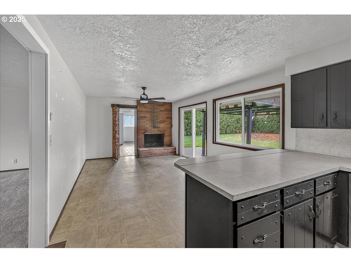 57827 South Bachelor Flat Road Warren, OR 97053 - Photo 23 of 38 a view of kitchen with granite countertop cabinets and sink