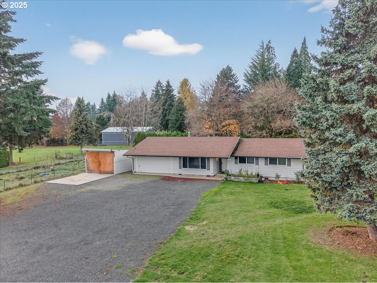 57827 South Bachelor Flat Road Warren, OR 97053 - Photo 3 of 38 a view of a house with backyard and a tree