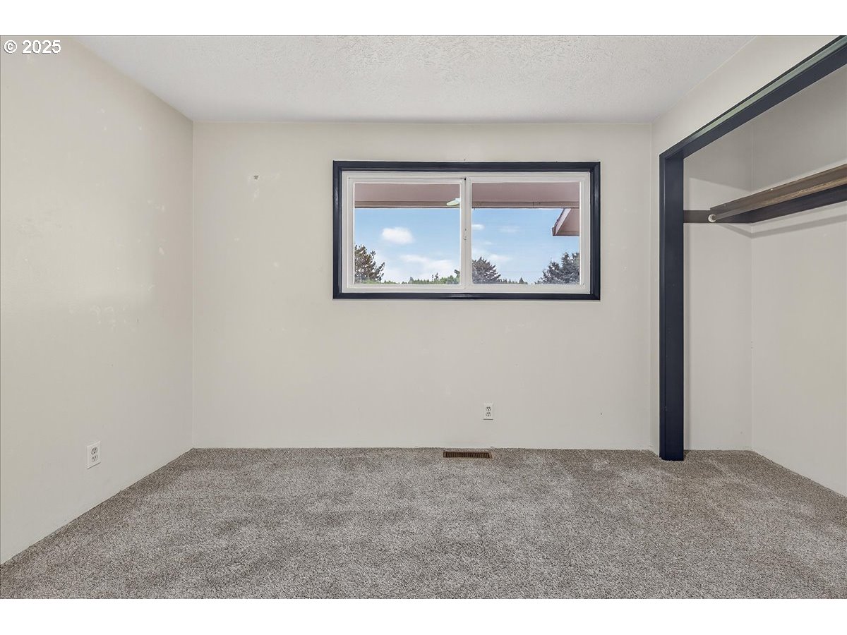 57827 South Bachelor Flat Road Warren, OR 97053 - Photo 31 of 38 a view of an empty room with painting on the wall