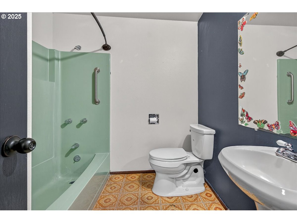 57827 South Bachelor Flat Road Warren, OR 97053 - Photo 33 of 38 a bathroom with a toilet a sink and a shower