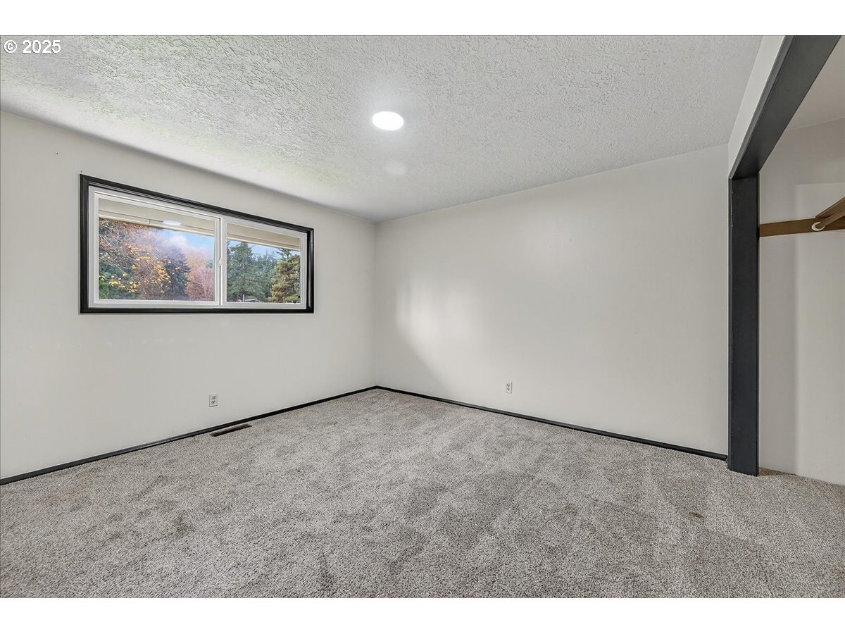 57827 South Bachelor Flat Road Warren, OR 97053 - Photo 36 of 38 a view of an empty room with a window