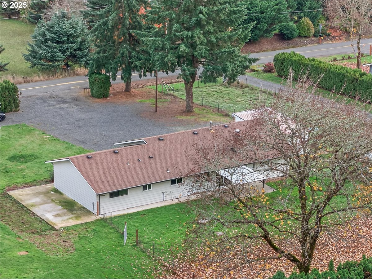 57827 South Bachelor Flat Road Warren, OR 97053 - Photo 7 of 38 an aerial view of a house with yard and tree in it