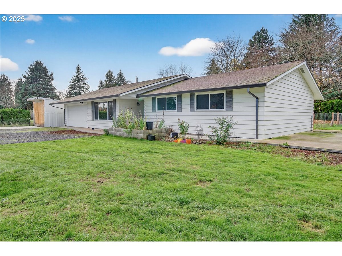 57827 South Bachelor Flat Road Warren, OR 97053 - Photo 10 of 38 a front view of house with yard and trees in the background