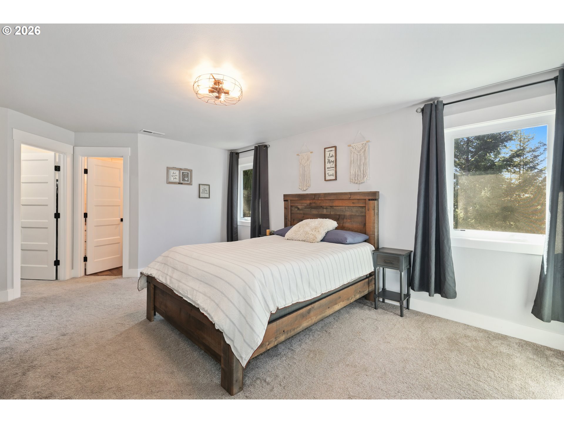 204 St Helens Way Winlock, WA 98596 - Photo 11 of 42 a spacious bedroom with a bed and a window