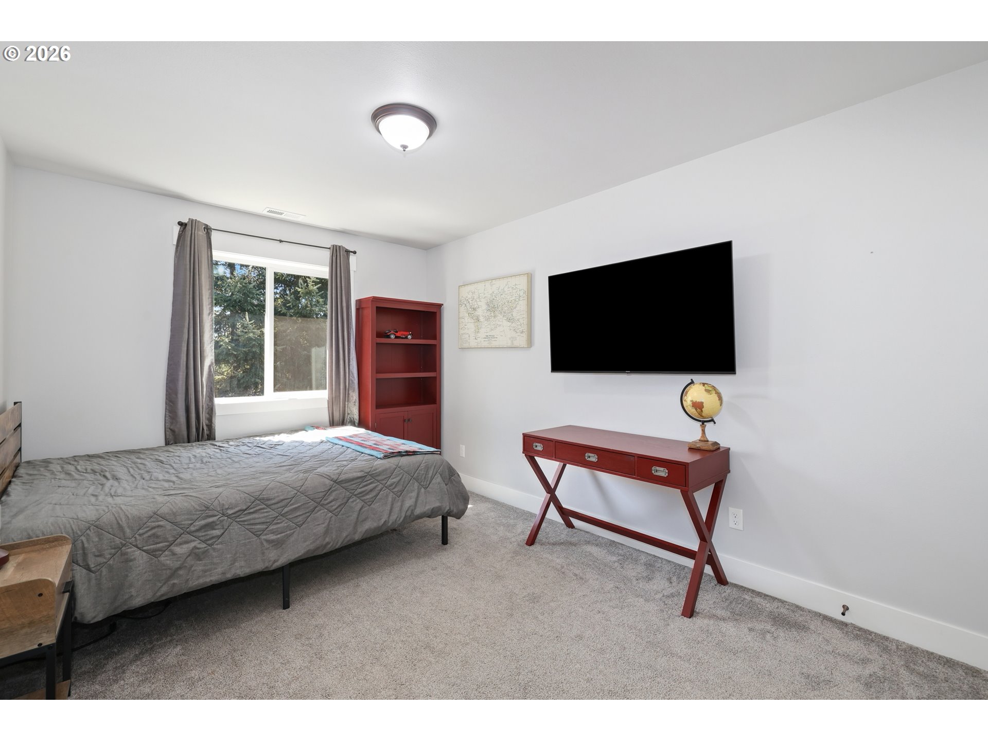 204 St Helens Way Winlock, WA 98596 - Photo 18 of 42 a bedroom with a bed and a flat screen tv