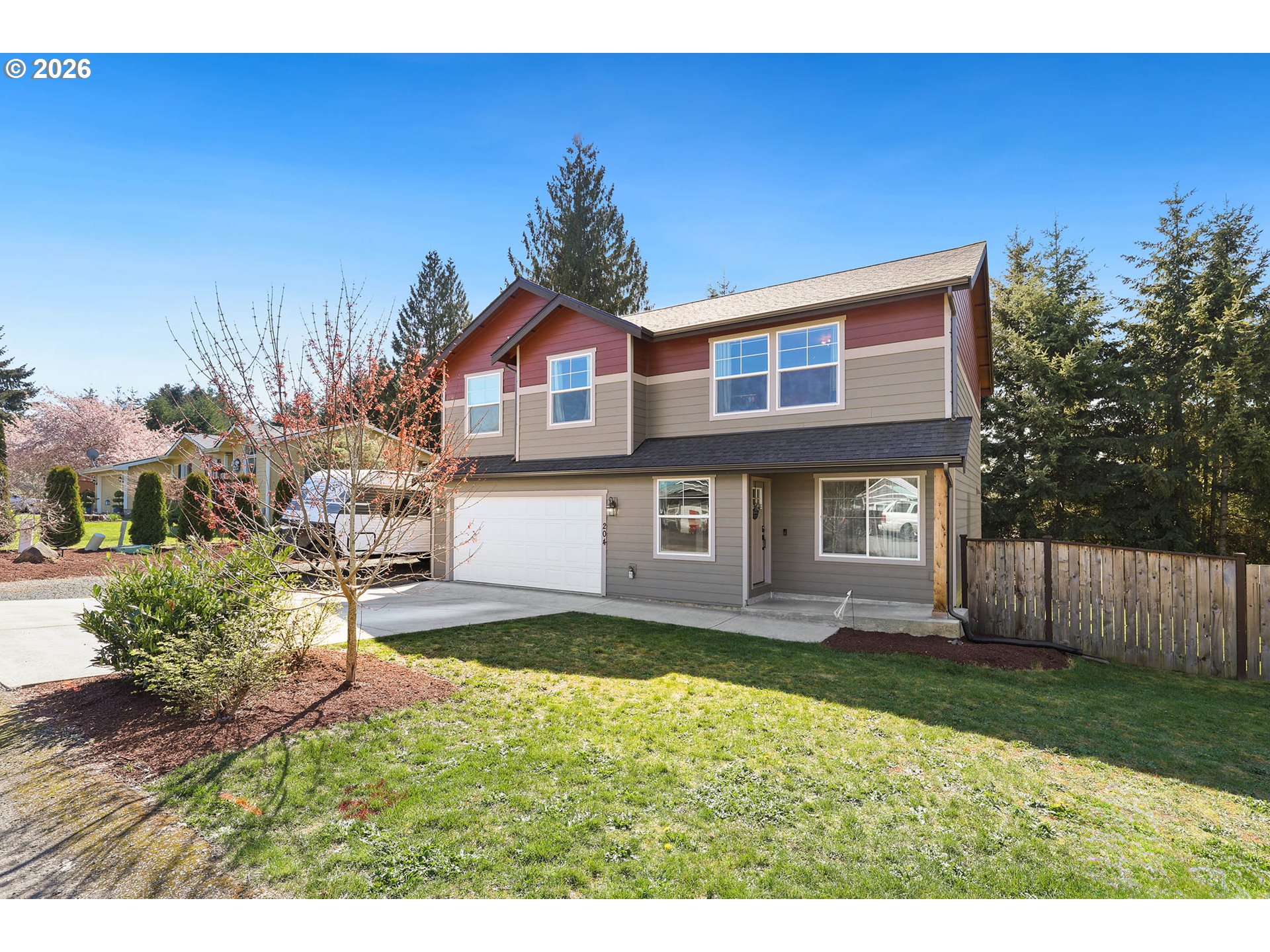 204 St Helens Way Winlock, WA 98596 - Photo 2 of 42 a front view of a house with a yard and garage
