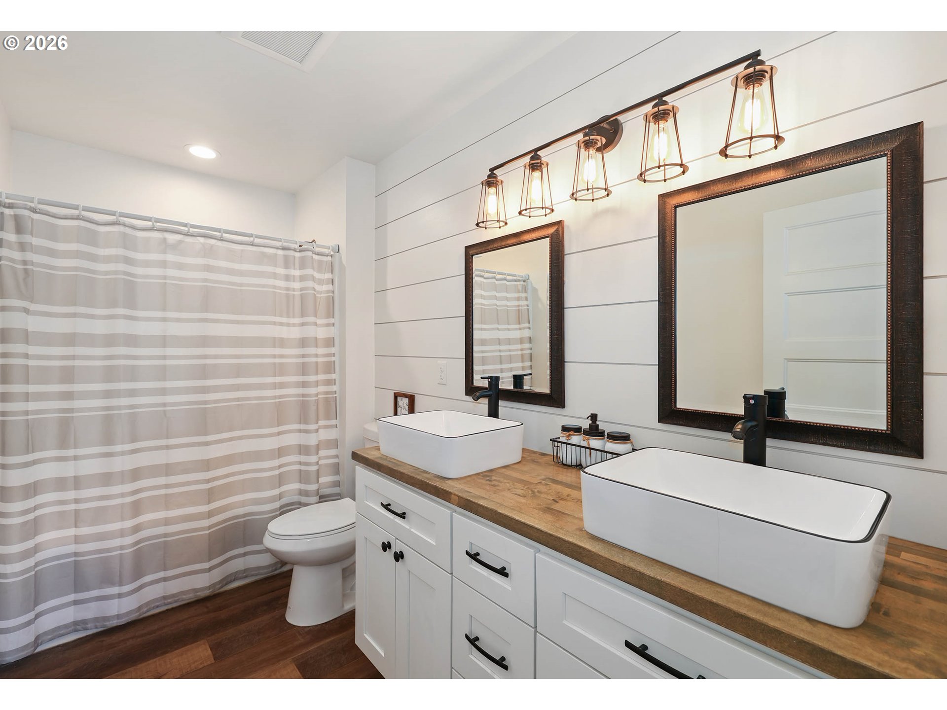 204 St Helens Way Winlock, WA 98596 - Photo 23 of 42 a bathroom with a double vanity sink toilet and mirror