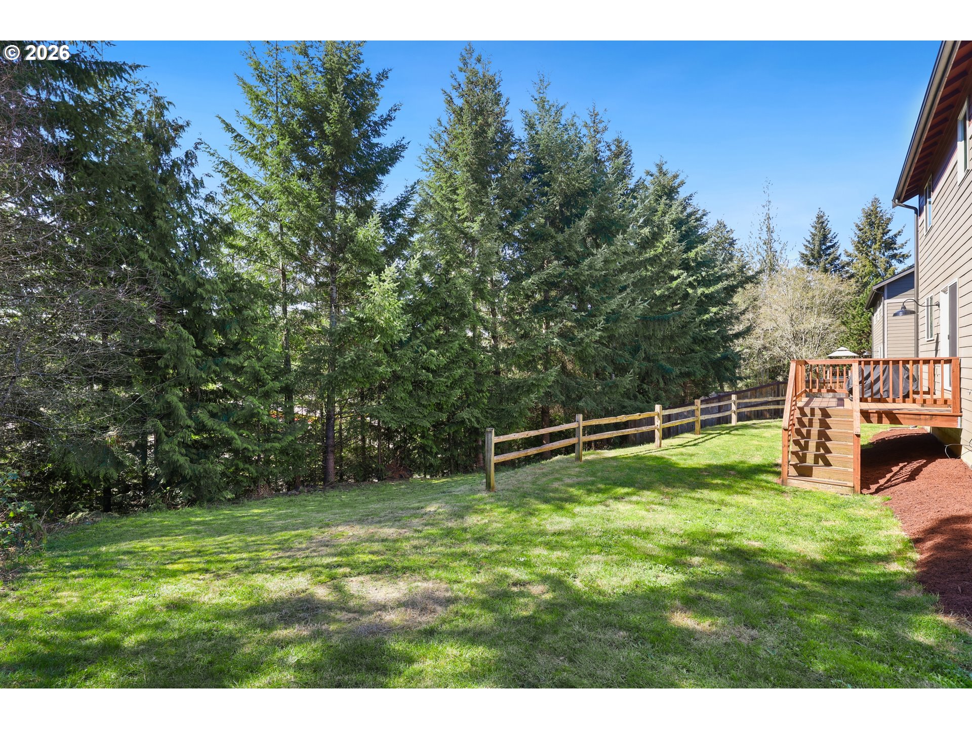 204 St Helens Way Winlock, WA 98596 - Photo 27 of 42 a backyard of a house with lots of green space
