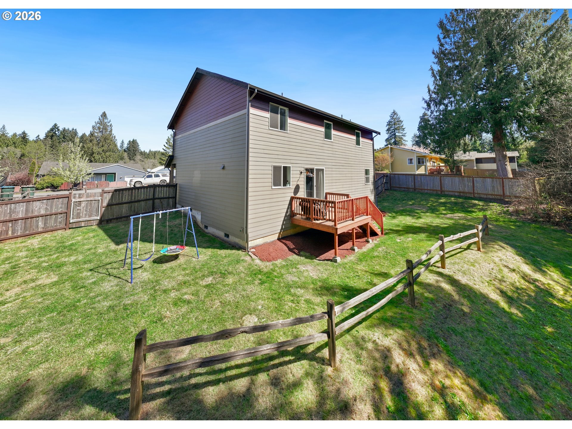 204 St Helens Way Winlock, WA 98596 - Photo 33 of 42 a backyard of a house with table and chairs