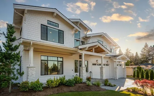 a front view of a house with garden
