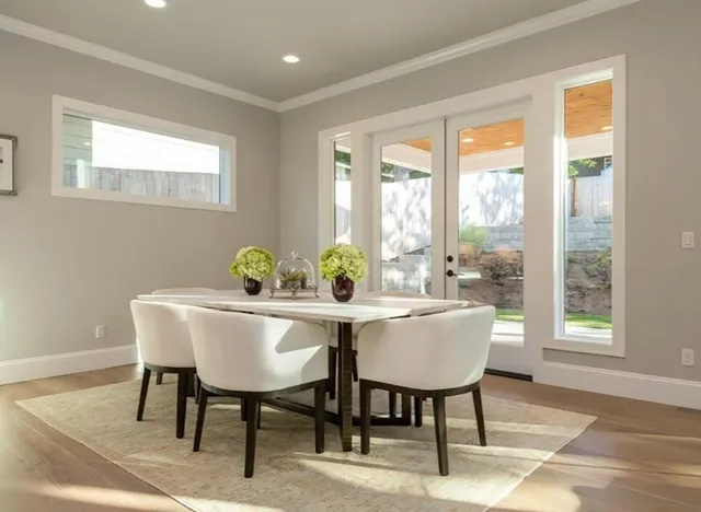 a view of a dining room with furniture window and outside view