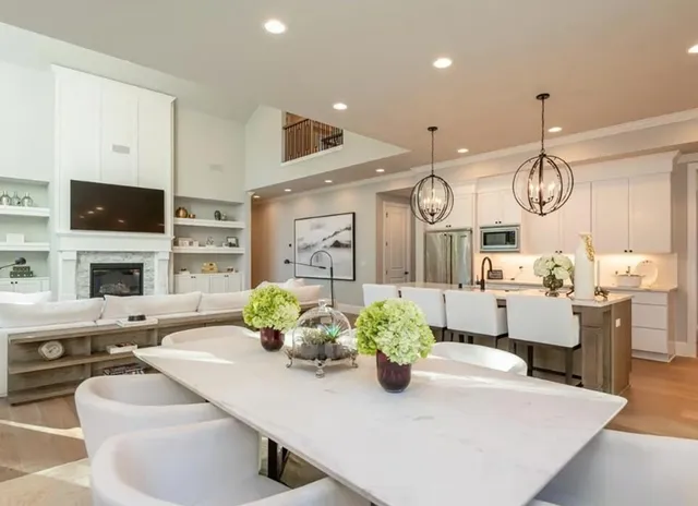 a living room with fireplace furniture and a flat screen tv