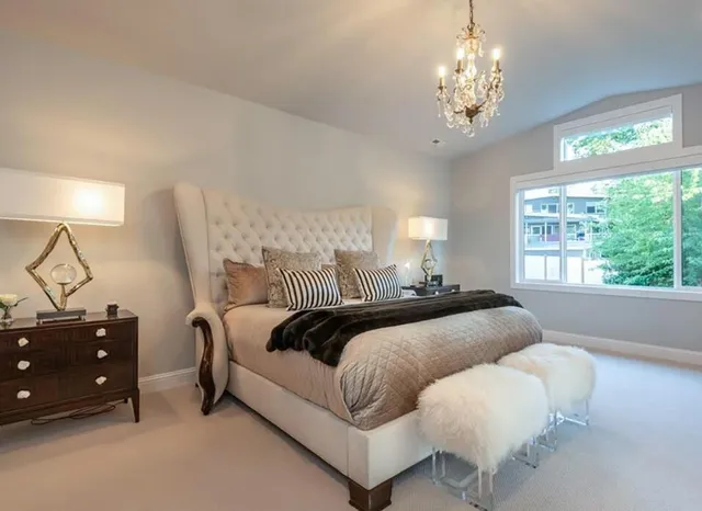 a bedroom with bed and window