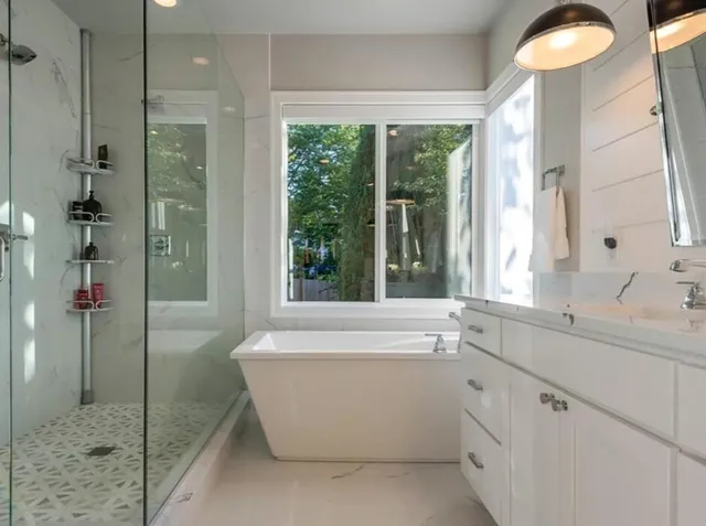 a bathroom with a bathtub and a sink