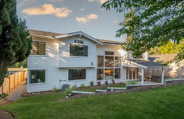 a front view of house with yard and outdoor seating