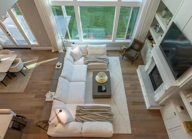 a living room with furniture and a fireplace