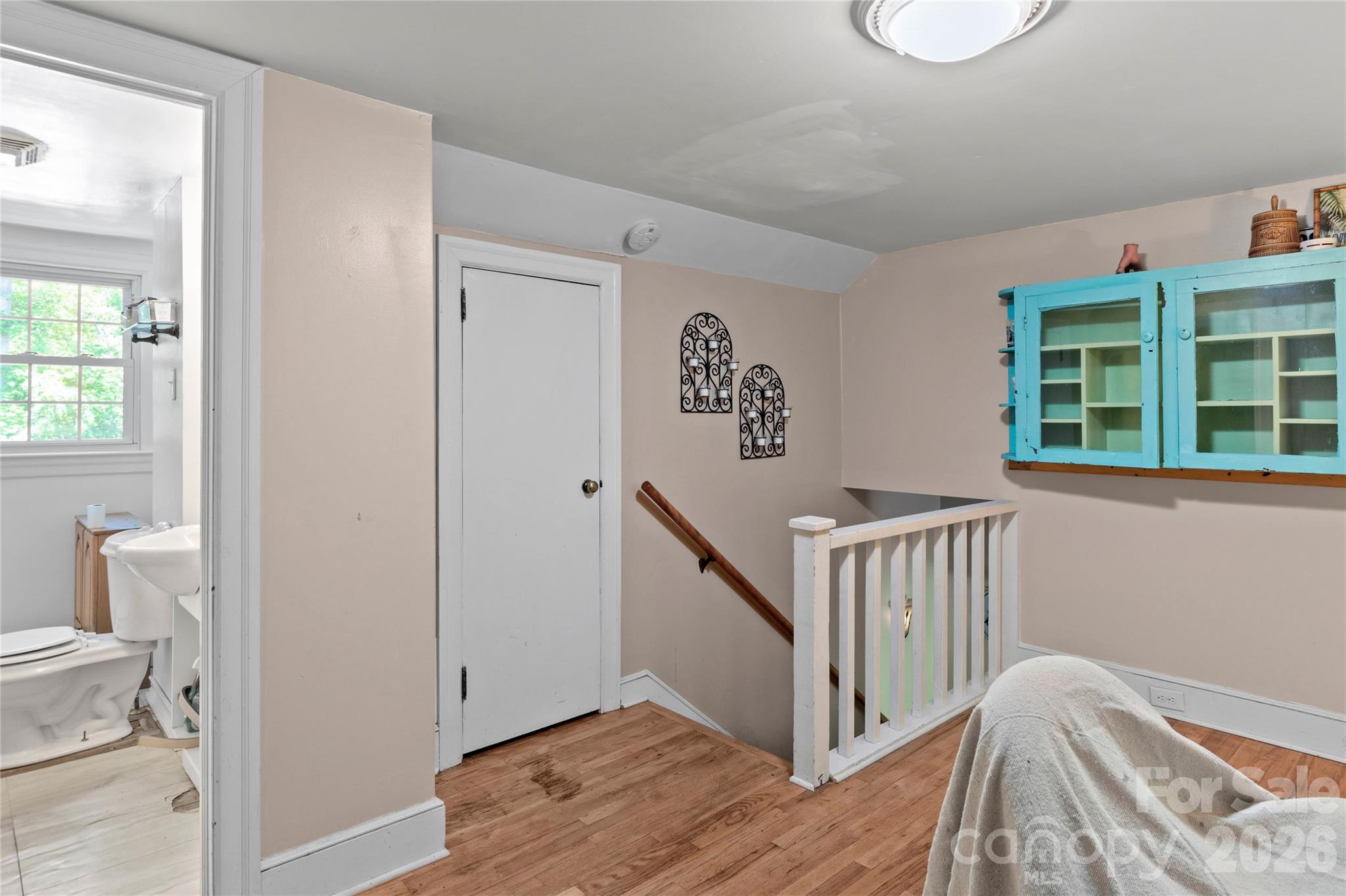 951 Dodson Mill Road Pilot Mountain, NC 27041 - Photo 28 of 48 a view of a hallway with bathroom and wooden floor