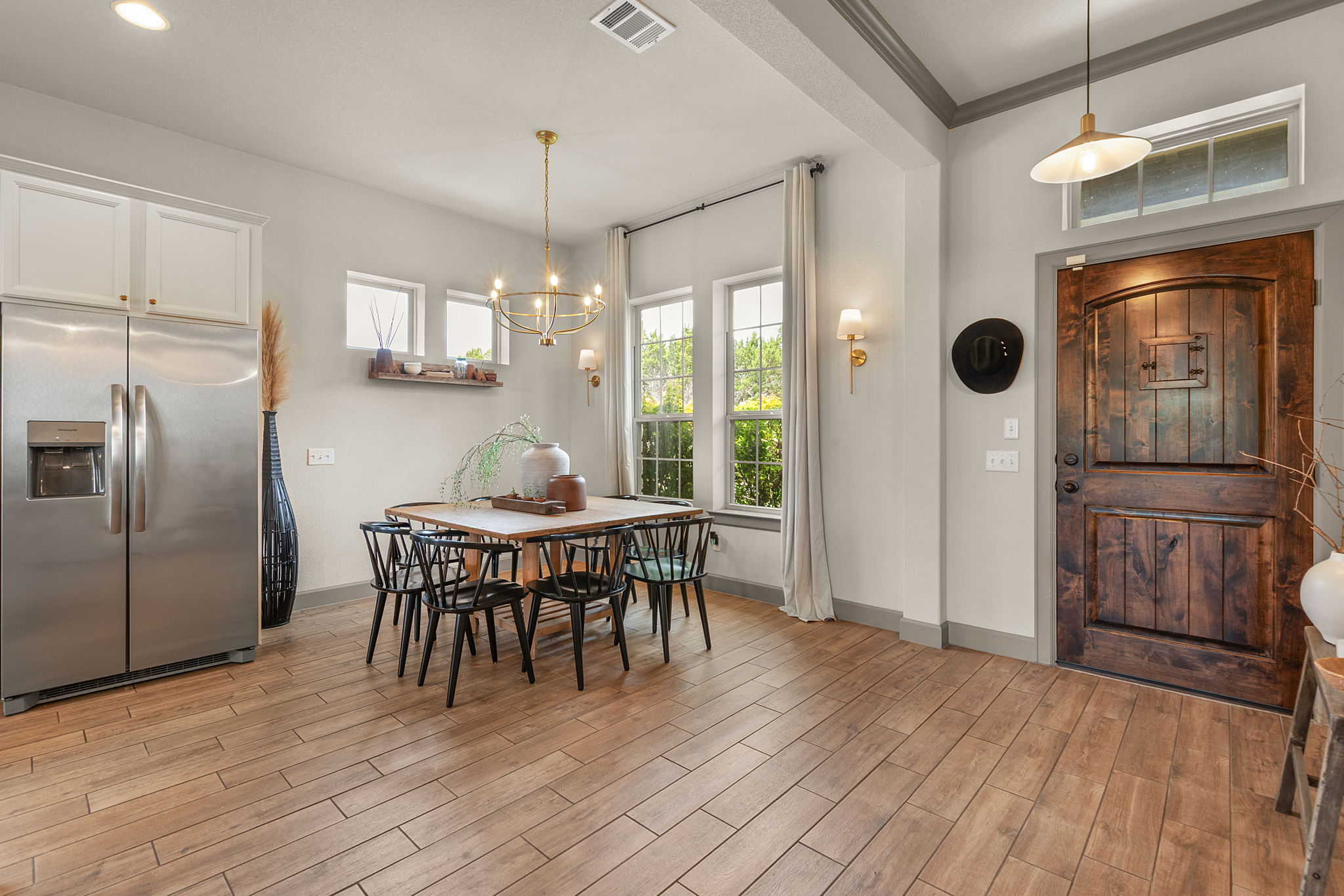 155 Balcones Ridge Way Bertram, TX 78605 - Photo 10 of 37 Enter into an inviting open-concept dining space with ample natural light.