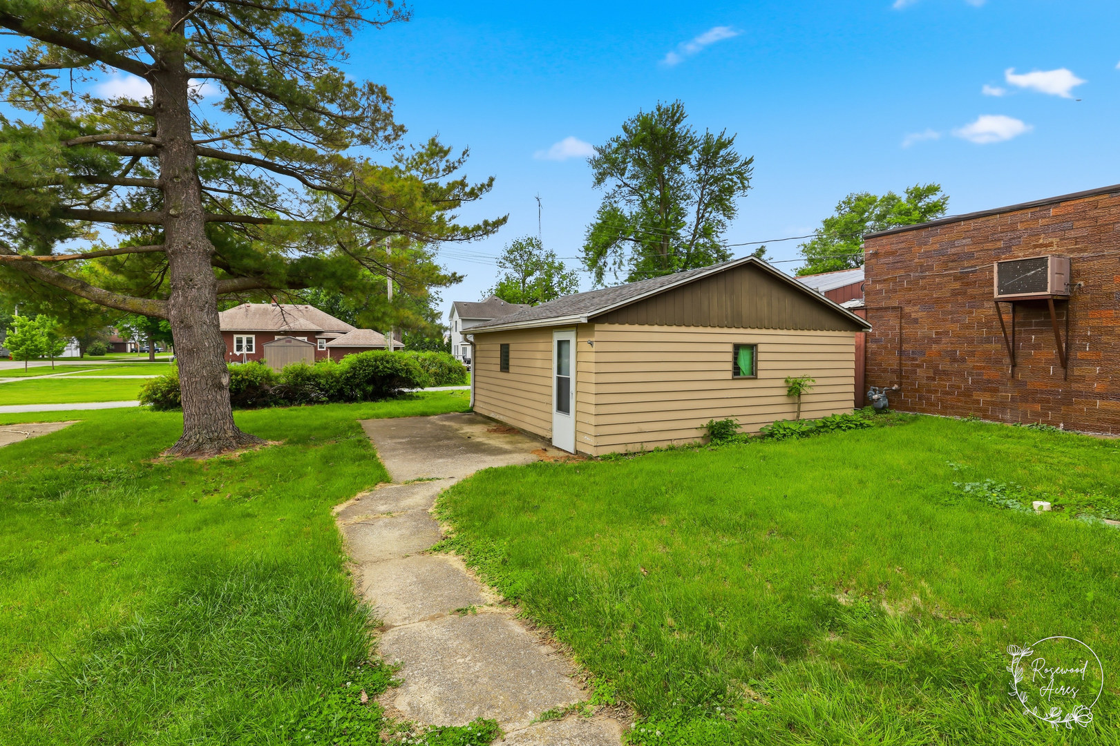 409 Main Street Crescent City, IL 60928 - Photo 19 of 22 a front view of a house with garden
