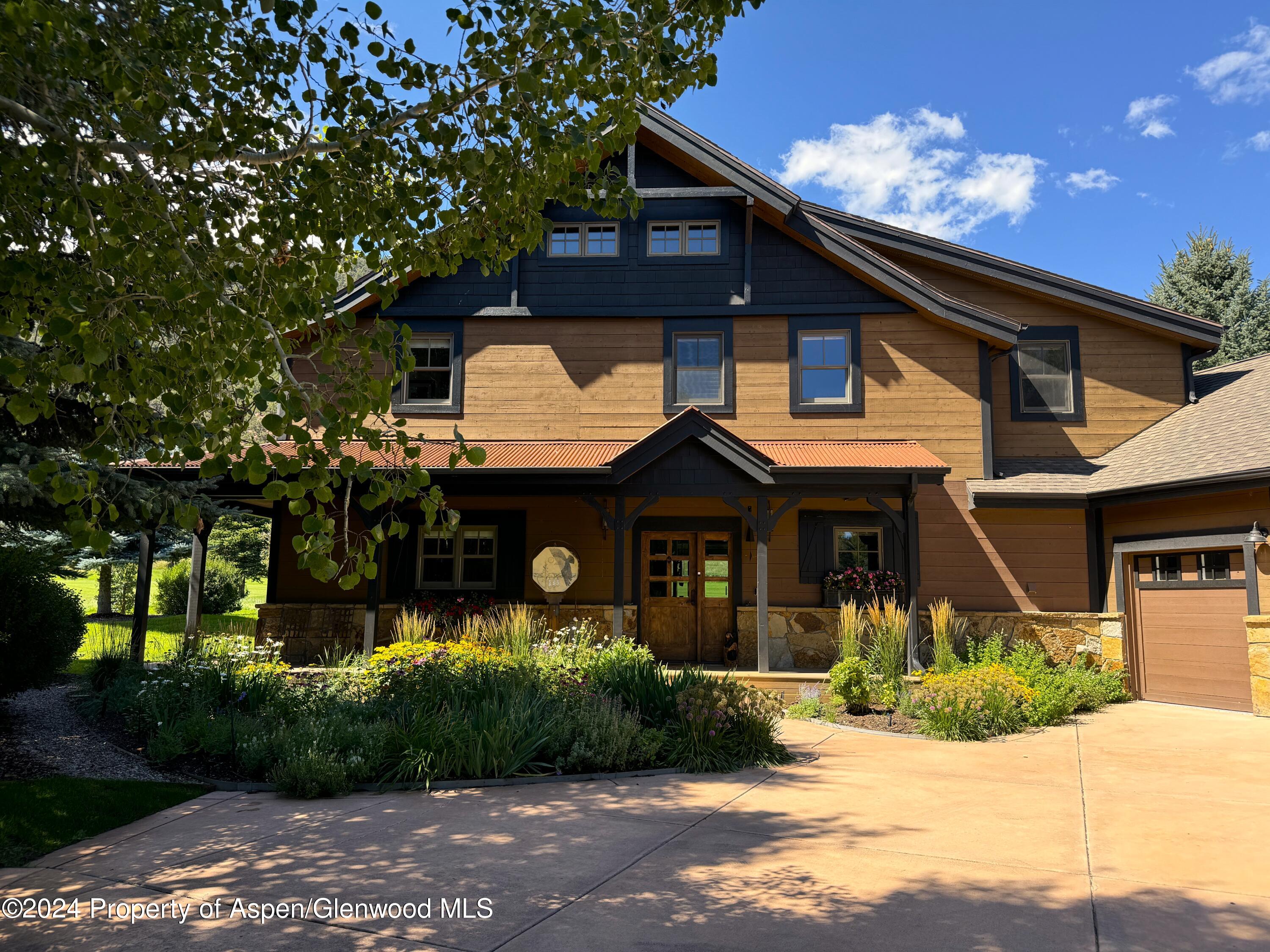245 Saddleback Road Carbondale, CO 81623 - Photo 1 of 1 a front view of a house with a yard