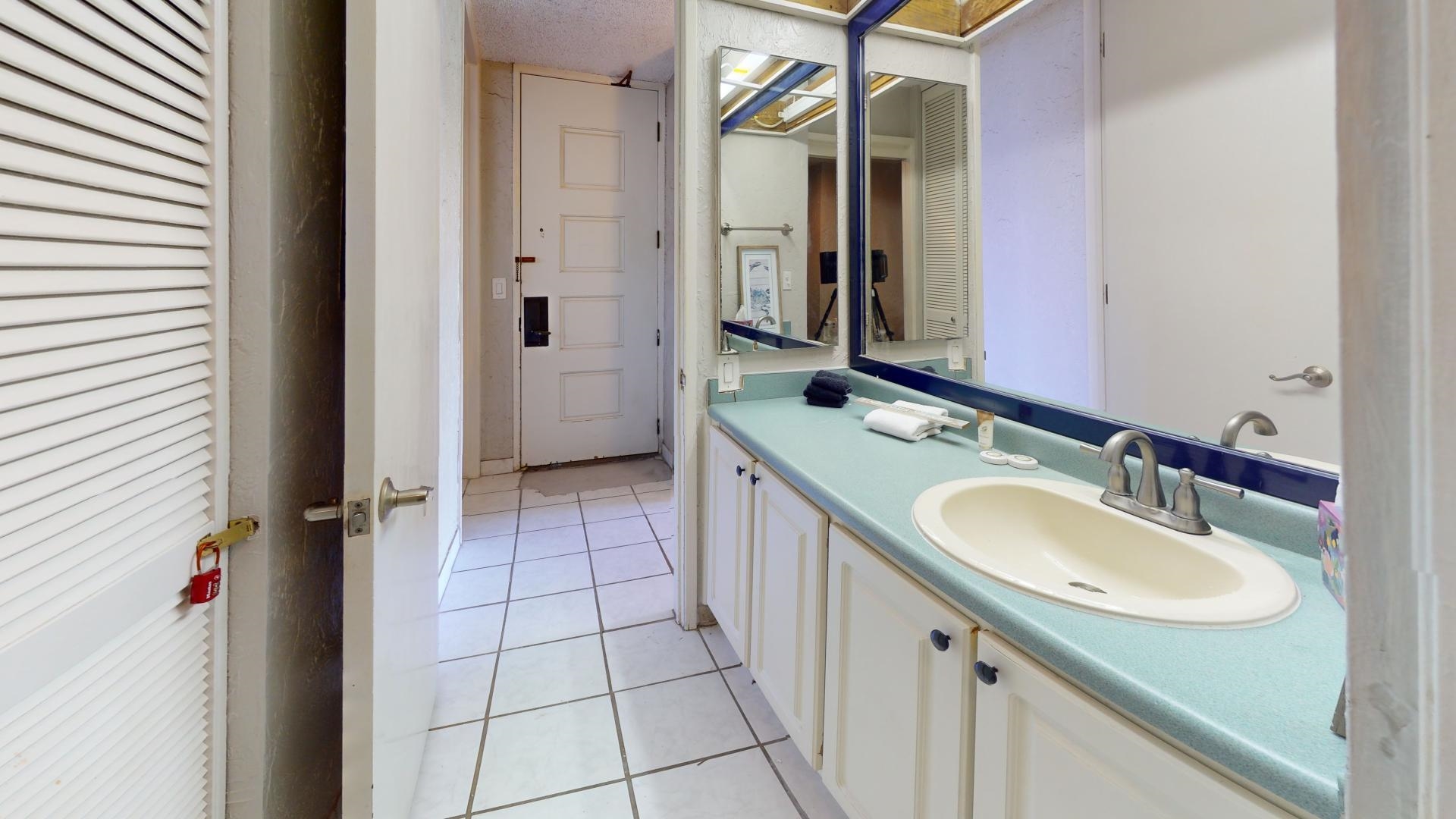 3543 Lower Honoapiilani Road, Unit A107 Lahaina, HI 96761 - Photo 16 of 19 a spacious bathroom with a double vanity sink a mirror and a bathtub